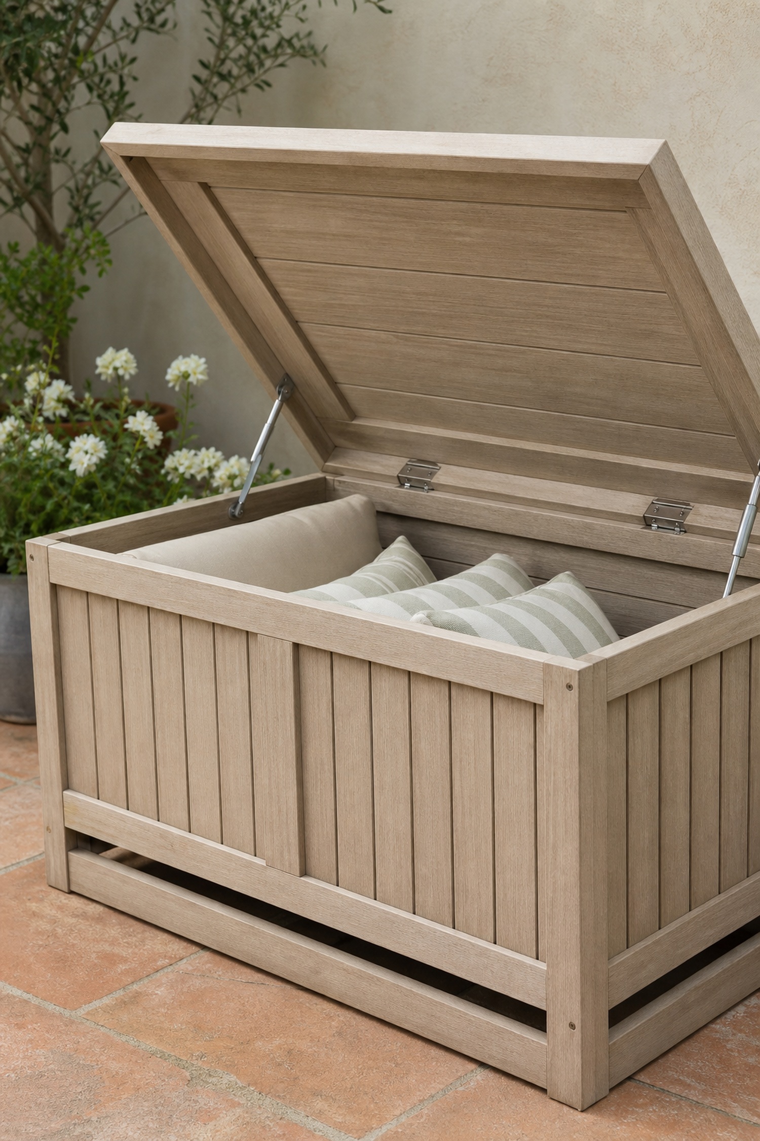 Conceptual wood outdoor storage box shown open with two lid supports and cushions inside