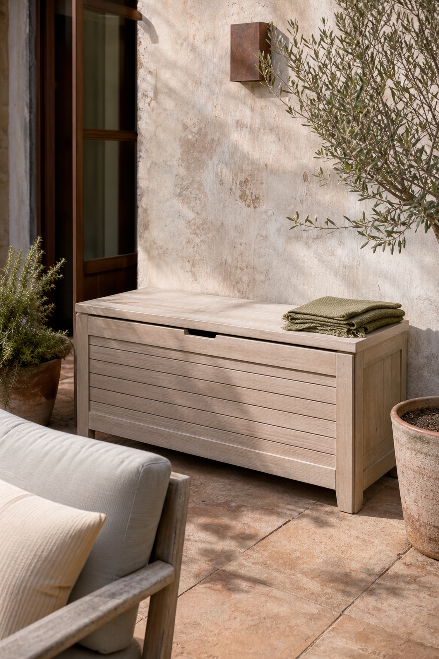Conceptual Sonnetta terrace with a closed wood outdoor storage box; not the Aubrey product