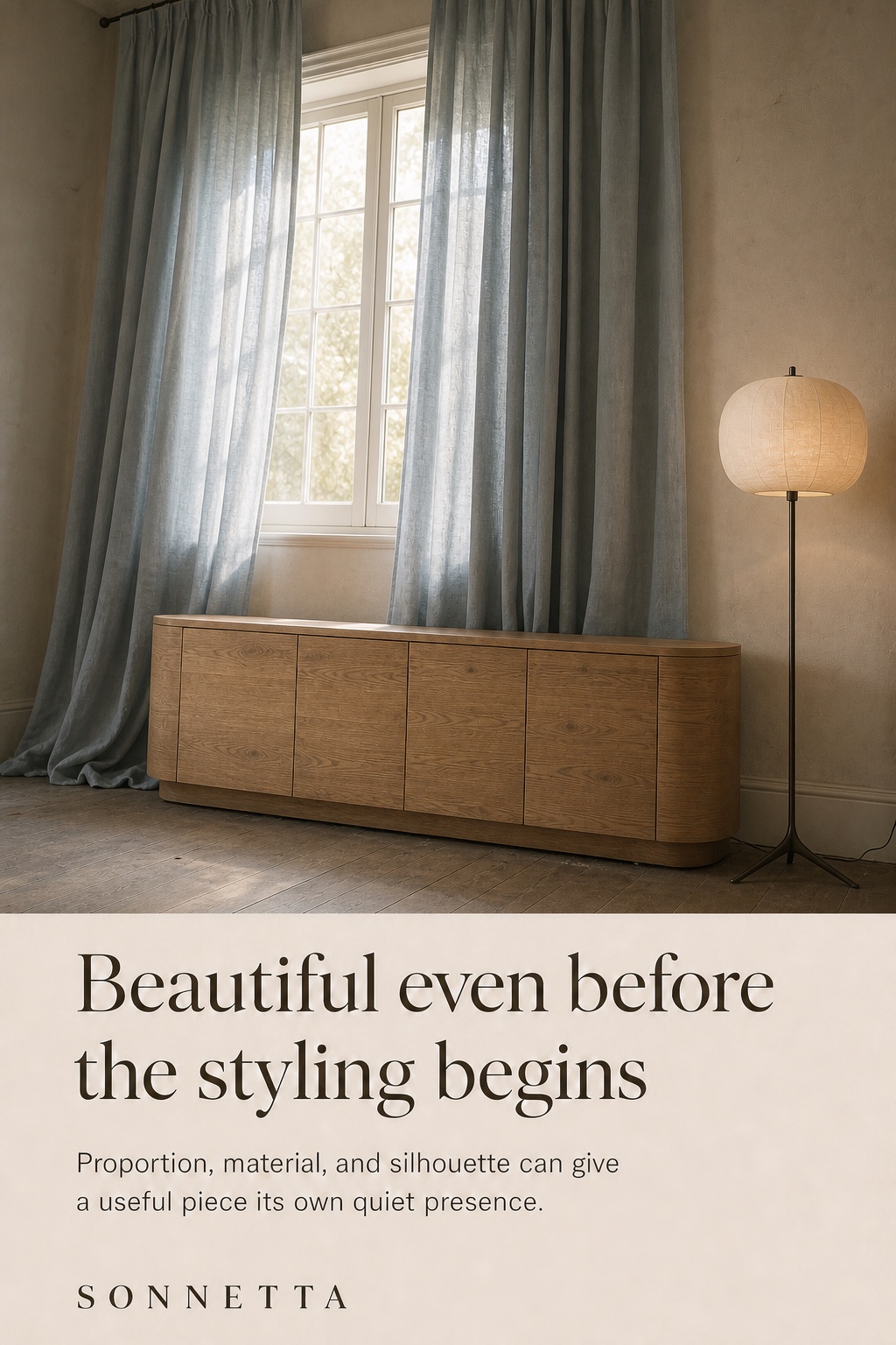 Original editorial oak sideboard standing alone in an imperfect plaster room