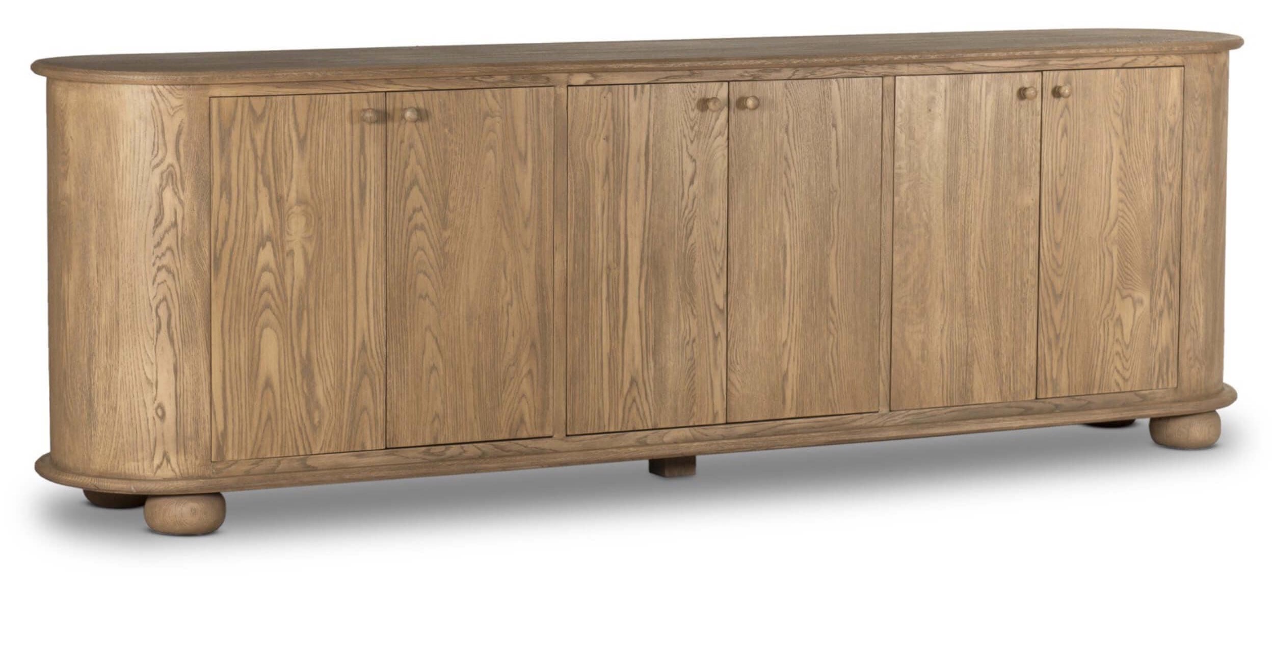 Amber Lewis x Four Hands Makai sideboard in light wash oak with rounded edges and bun feet.