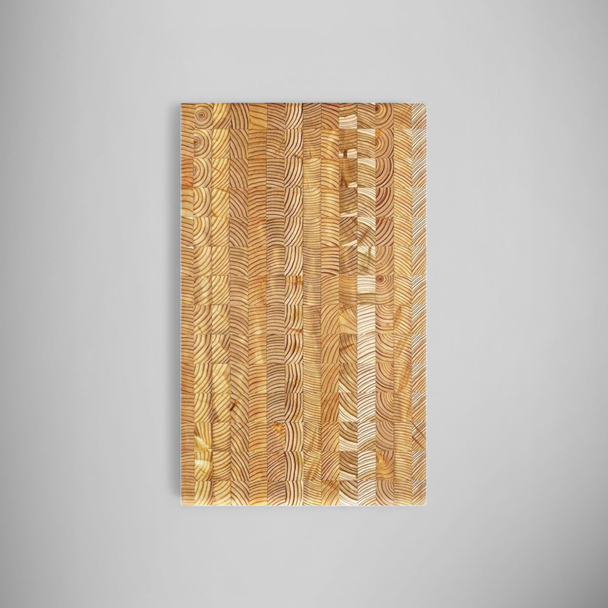 Premium kiln dried larch wood cutting board photographed on a pale surface.